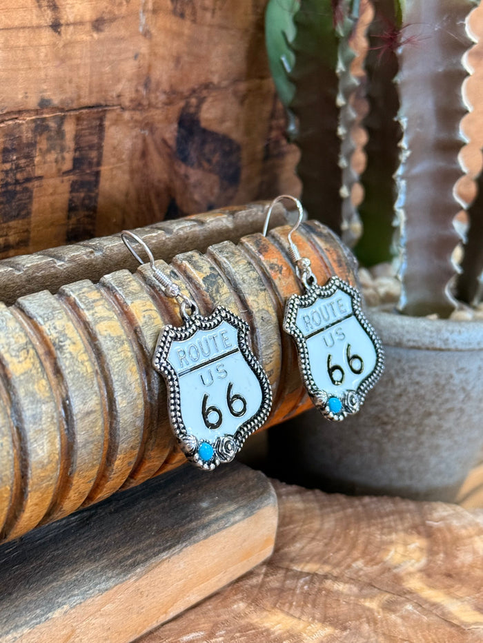 Silver-tone Route 66 drop earrings with turquoise bead tips and outlined 'ROUTE US 66' tag