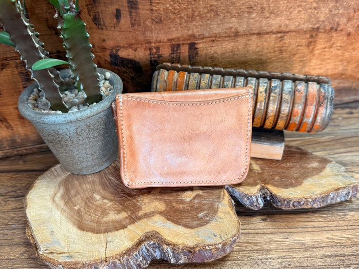 Tan leather wallet with stitched front flap and side profile