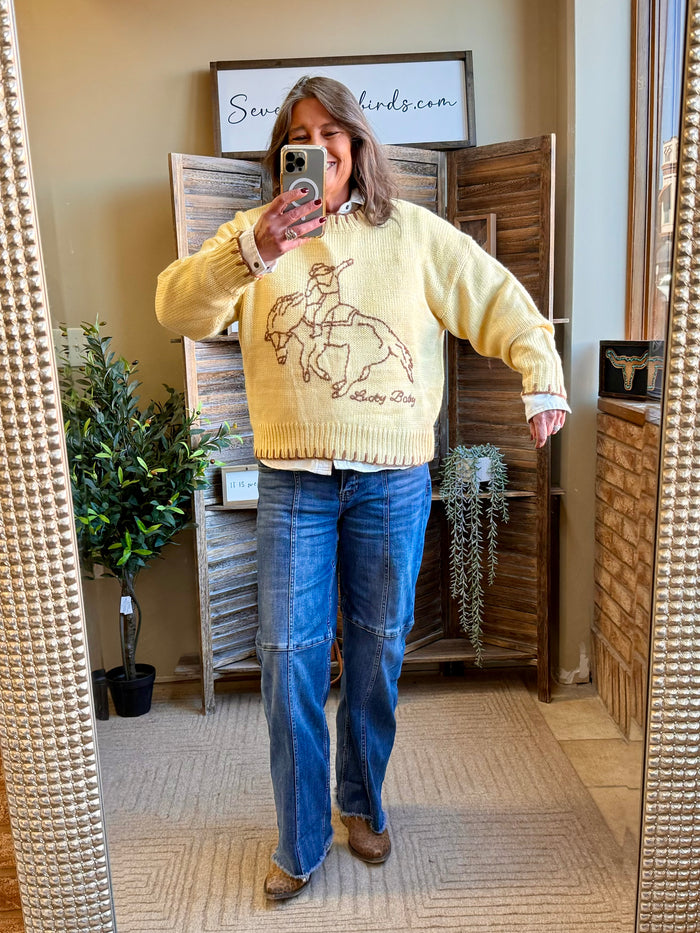 Mustard yellow knit sweater with stitched bronc/buck graphic, crewneck, ribbed cuffs