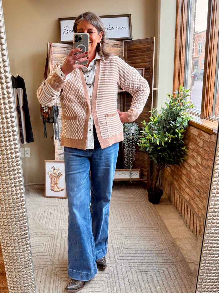 Checkered knit cardigan with tan and cream stripes, button-front V-neck.