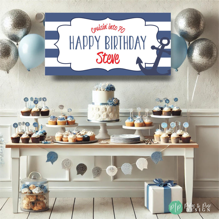 classic navy blue, red, and white personalized cruise ship birthday banner with an anchor in front of a blue and white dessert table