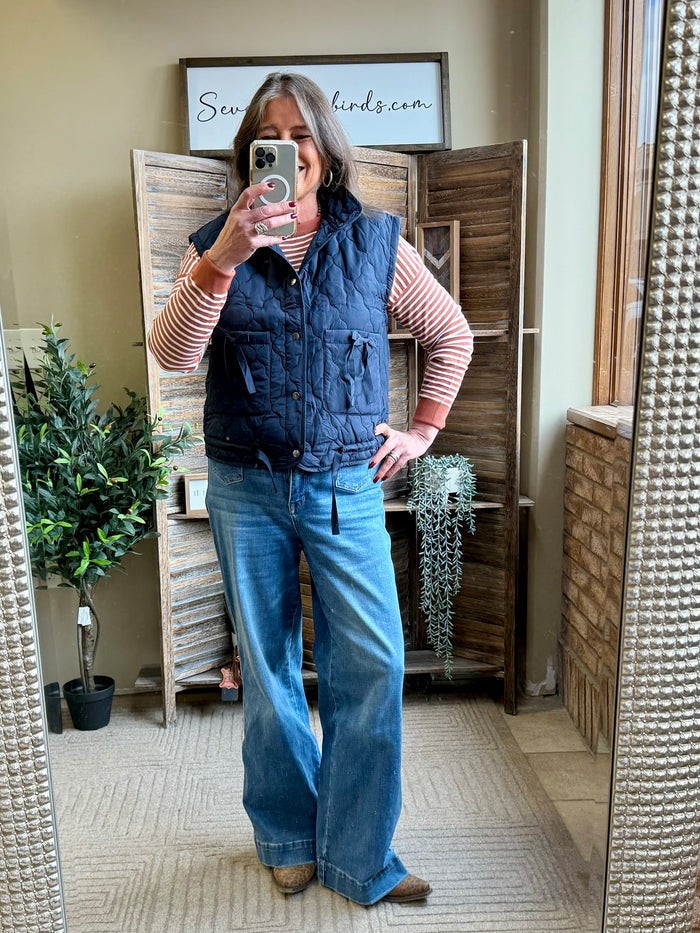Navy quilted puffer vest with zip front and side pockets