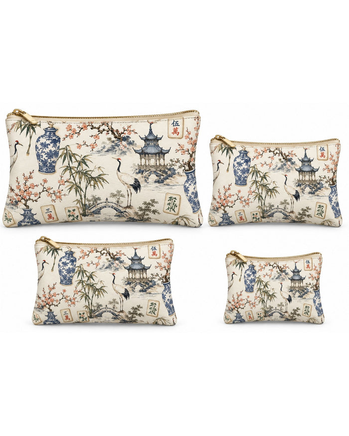 Set of four printed vegan leather zippered pouches in small-to-large sizes, gold-tone zippers