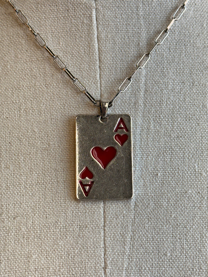 Rectangular card pendant necklace with red heart inlay and red A symbol on metal