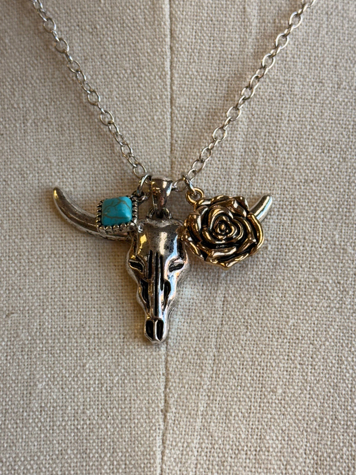 Cow skull and rose charm on silver chain with turquoise blue stone