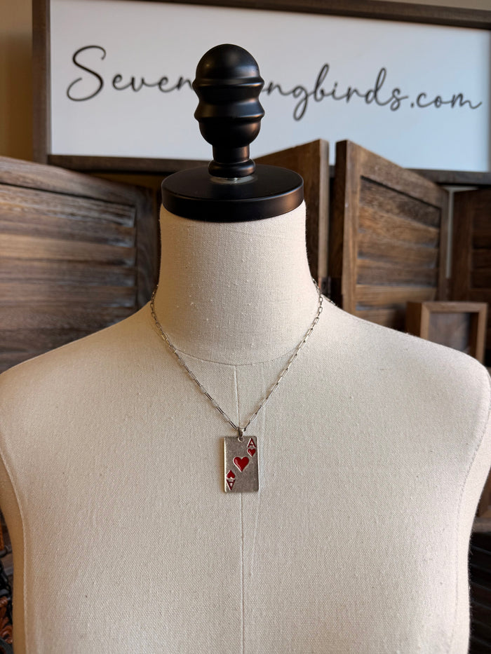 Silver chain necklace with rectangular card charm showing red hearts and letter A
