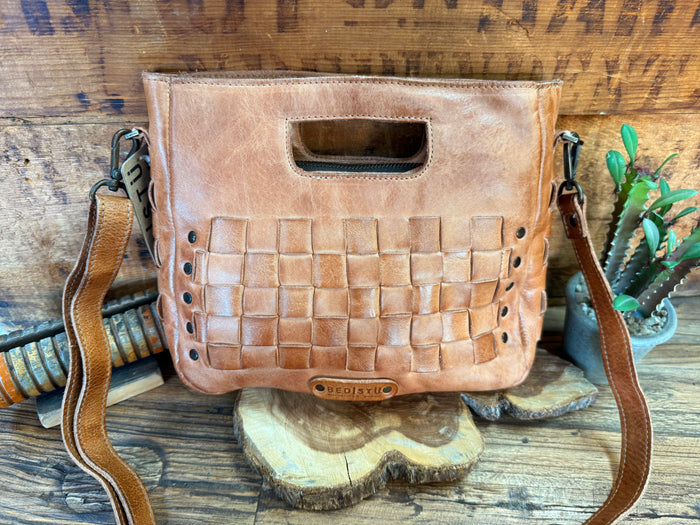 Keiki tan leather crossbody bag with woven front panel and small logo patch