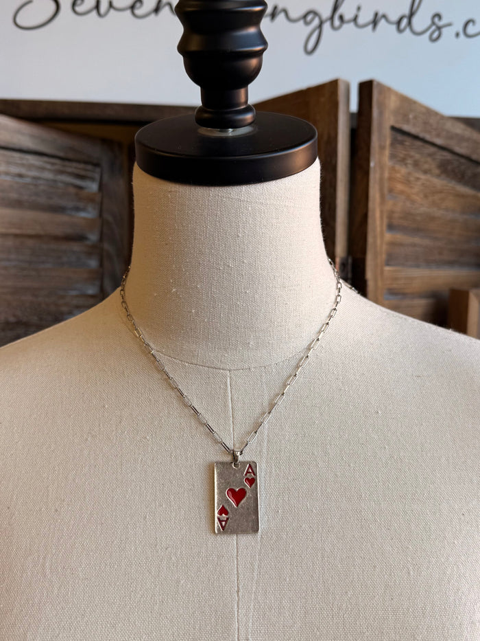 Silver chain necklace with rectangular pendant charm featuring red hearts and letter A