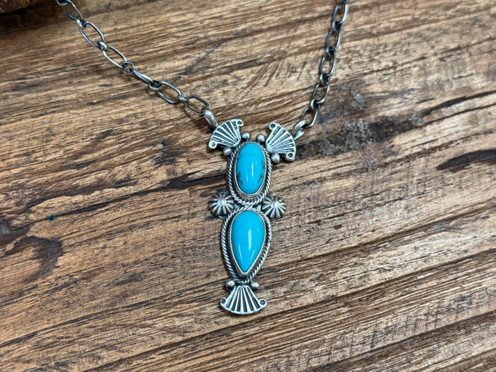 Turquoise oval cabochon pendant necklace with scalloped silver detailing