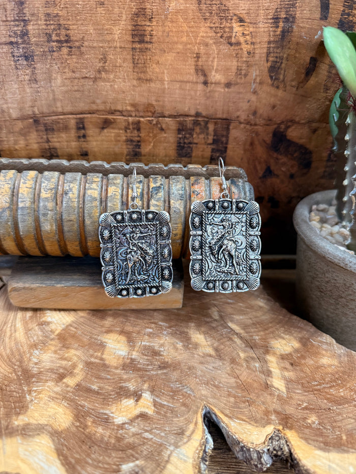 Silver-tone ornate rectangular drop earrings with detailed filigree designs
