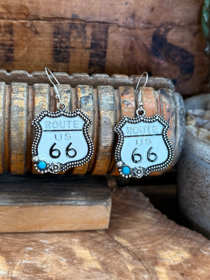 Silver-tone Route 66 earrings, turquoise bead details, visible 'ROUTE US 66' text