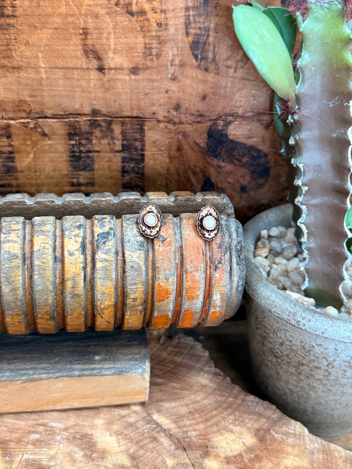 Copper concho stud earrings, round orange cabochon with ornate silver-tone bezel