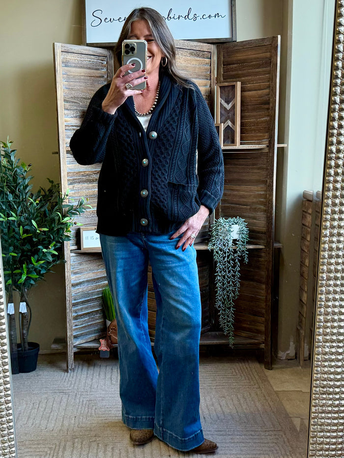Dark cable-knit cardigan with button front and ribbed shawl collar