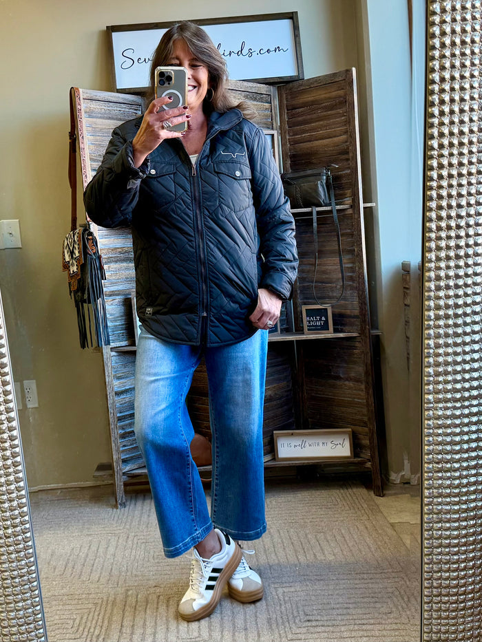Dark quilted coat with stand collar and snap buttons, full-body mirror selfie