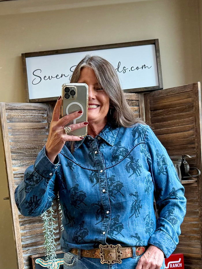 Blue denim snap-front western shirt with dark print, long sleeves, snap buttons