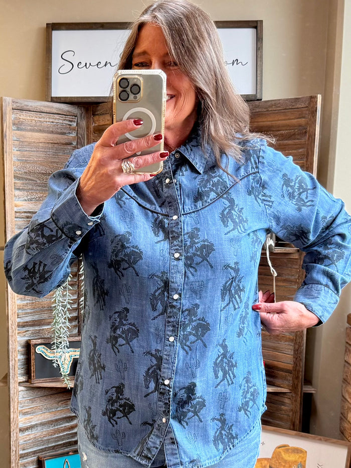 Blue denim snap-front shirt with dark western print, long sleeves, snap buttons