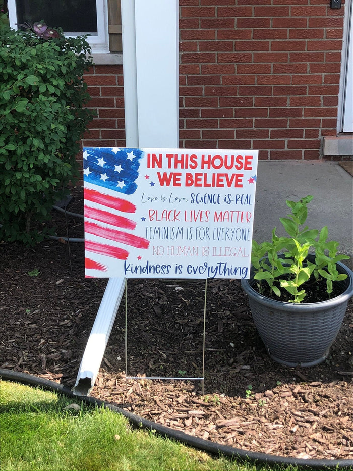 In this House yard sign