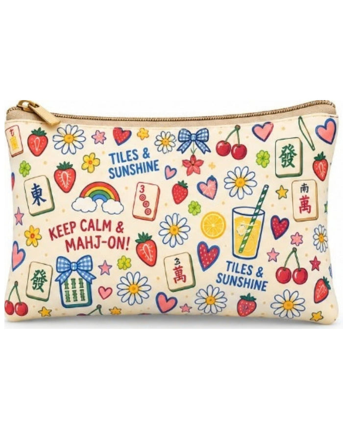 Beige printed zipper pouch close-up with multicolor icons, hearts, and gold zipper