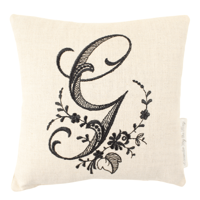 Monogrammed lavender pillow sachet with black letter G on white background