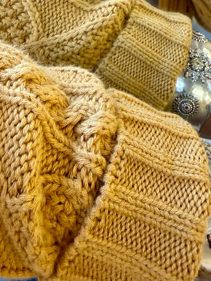 Mustard yellow cable-knit cotton cardigan, chunky textured knit and ribbed cuffs