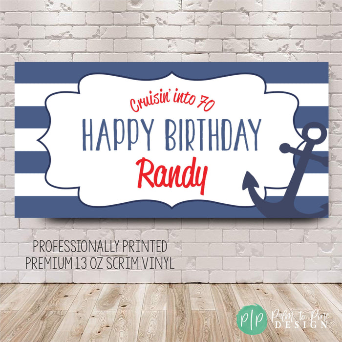 A blue and white striped banner with a navy anchor and the text 'Cruisin' into (age) Happy Birthday Name' in red. The banner is professionally printed on premium 13 oz scrim vinyl and is perfect to celebrate a birthday on a cruise ship.