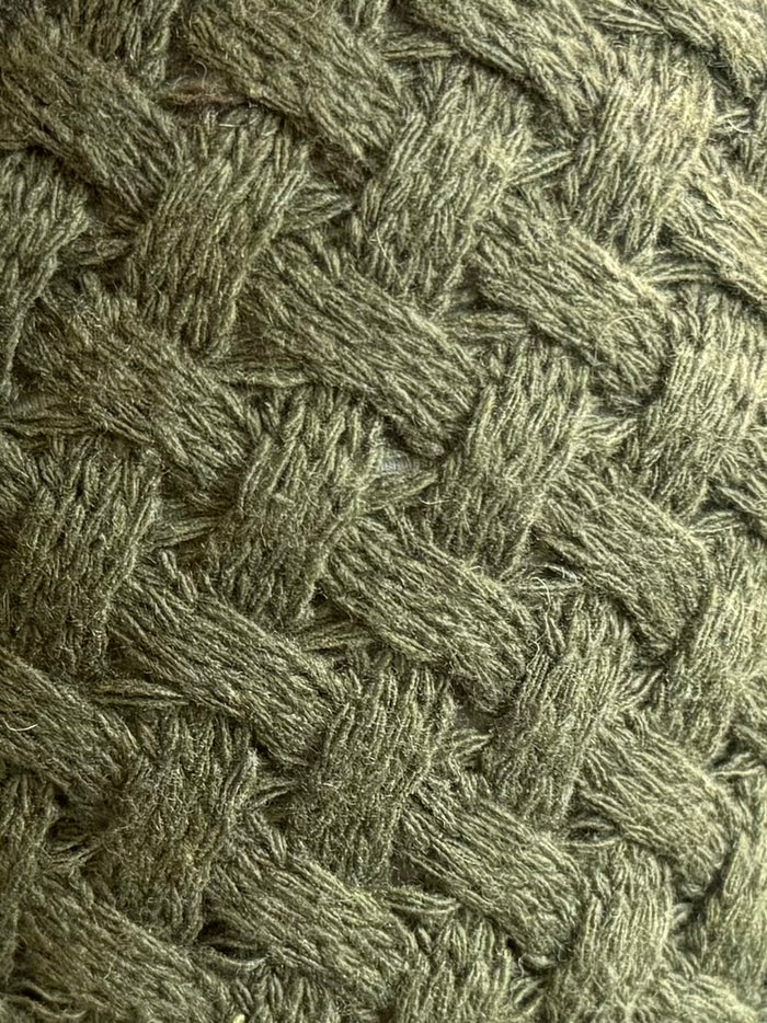 Olive green cable knit pattern on sweater front