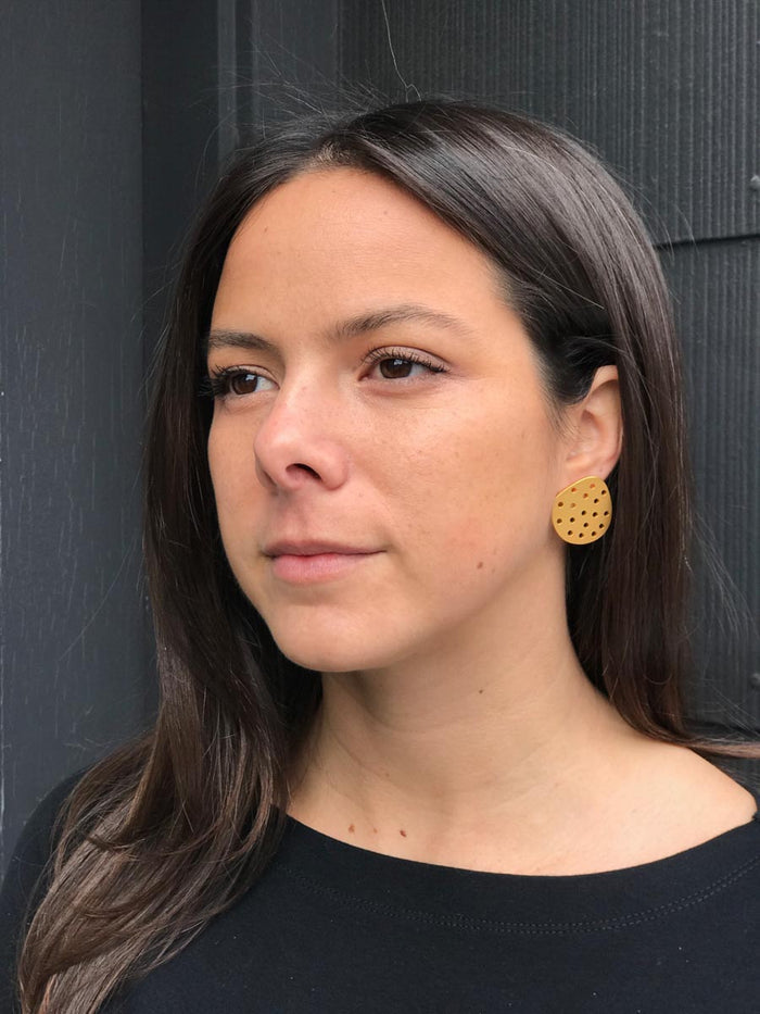 Perforated Circle Earrings in Gold Plated Steel. Sterling silver ear wires.