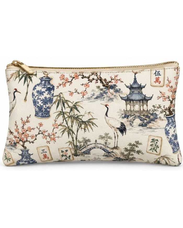 Printed vegan leather zippered pouch with gold-tone zipper, wide front view of pagoda artwork