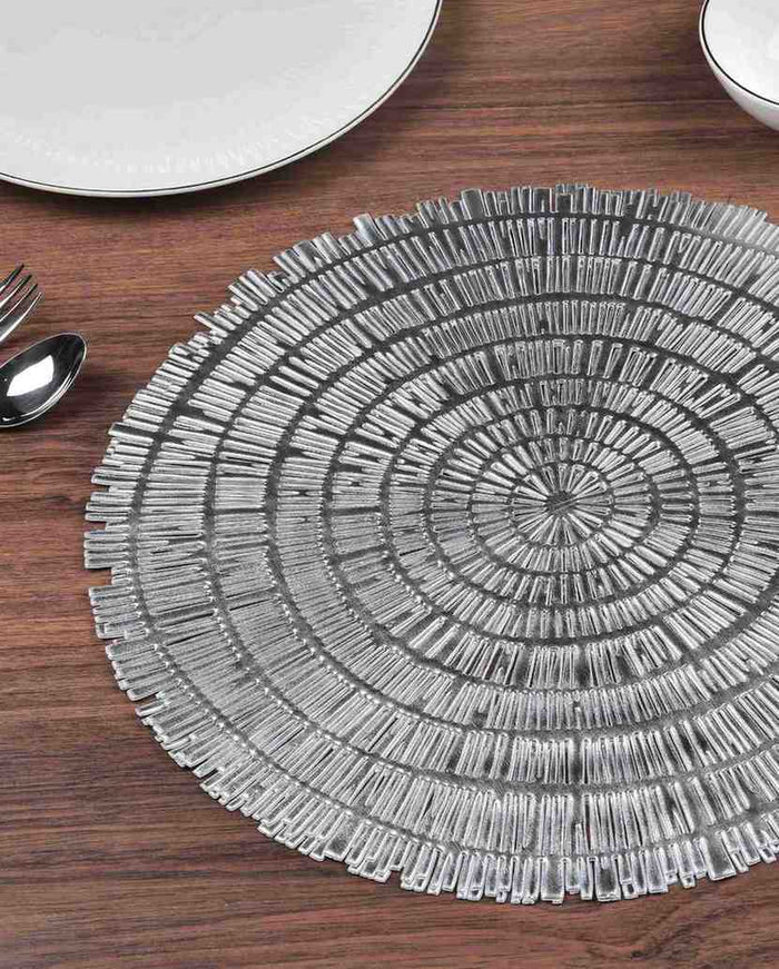 Round woven metallic table mat with concentric circular ring weave, silver tone
