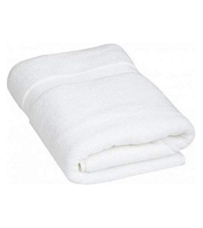 White bath towel folded with soft plush texture