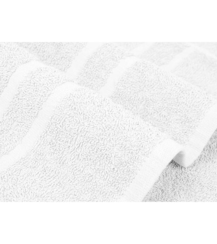 White bath towel with visible terry loops and folded edge