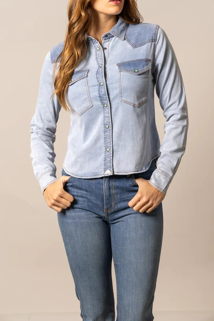 Light blue denim button-up shirt with chest pockets and long sleeves