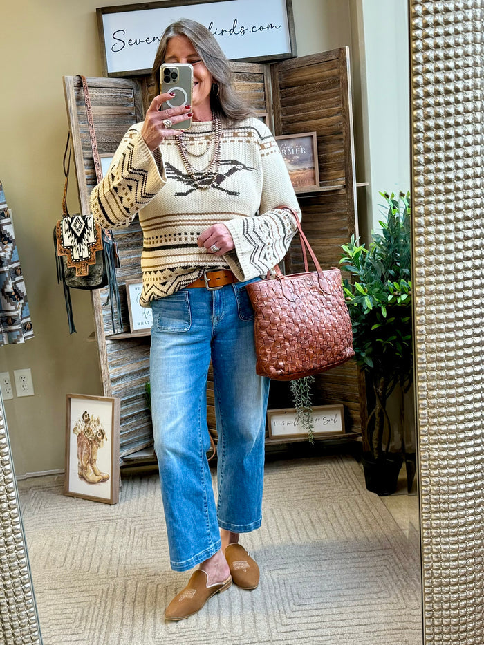 Crew neck sweater in tan with black and cream Fair Isle front and long sleeves.
