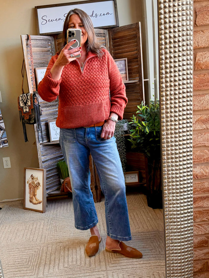 Rust quarter-zip cable-knit sweater with front pocket and ribbed hem, long sleeves