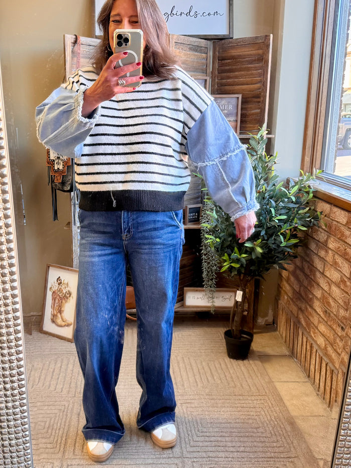Striped sweater with navy and cream stripes and wide denim sleeves with button cuff
