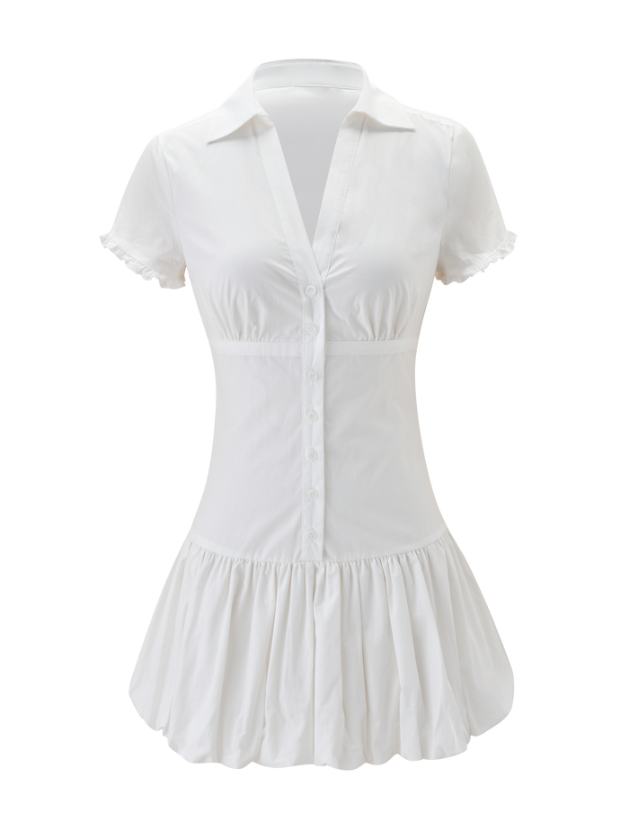 The VALERIE BUBBLE DRESS - WHITE by TIGERMIST is a white cotton mini dress with short sleeves, front buttons, a fitted waist, flared bubble skirt, and ruffled hem and sleeves for a playful, feminine style.