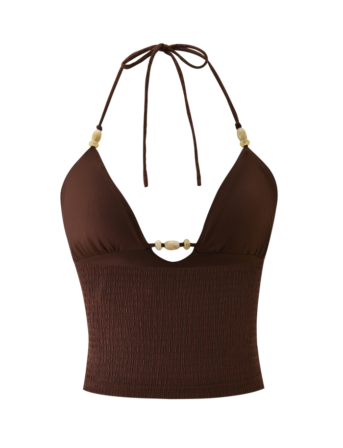 The ZINNIA TOP - CHOCOLATE by TIGERMIST is a chocolate brown halter cami crop top with a deep V neckline, beige bead details on the straps and front, and a smocked textured knit lower section.